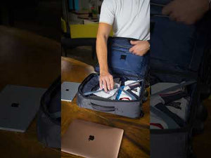Stylish travel trolley bag.
Perry Trolley Bag with visible laptop and iPad slits, demonstrating its secure storage features. The bag includes a front access pocket and a zipper compartment for stationery, combining style with functionality.