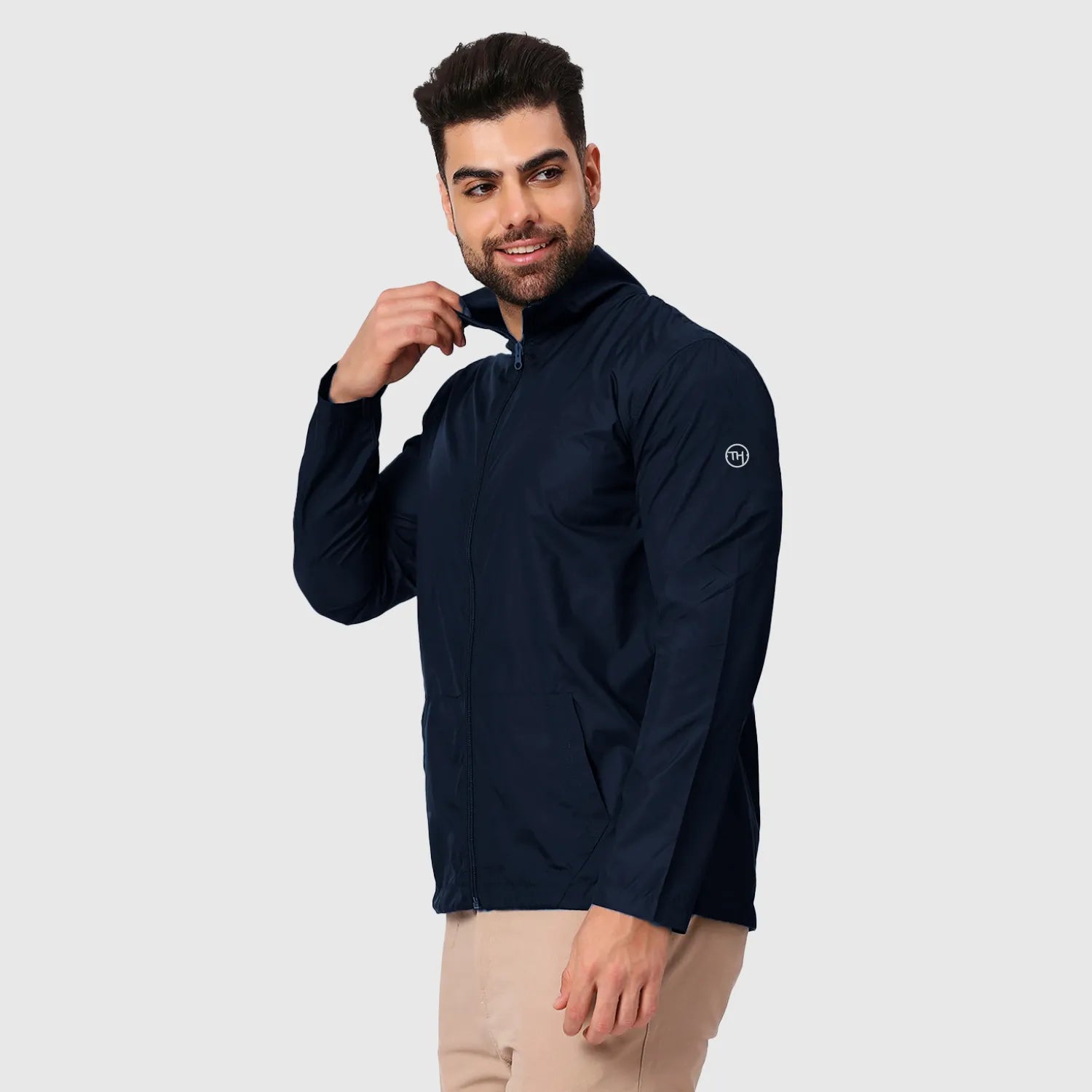 Navy blue windbreaker jacket with backpack India